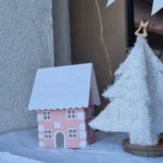 vitrine de noël papier rose et blanche